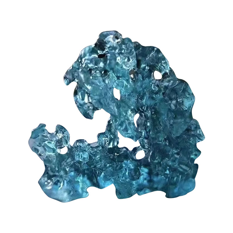 Ornamen kaca berwarna biru berbentuk batu